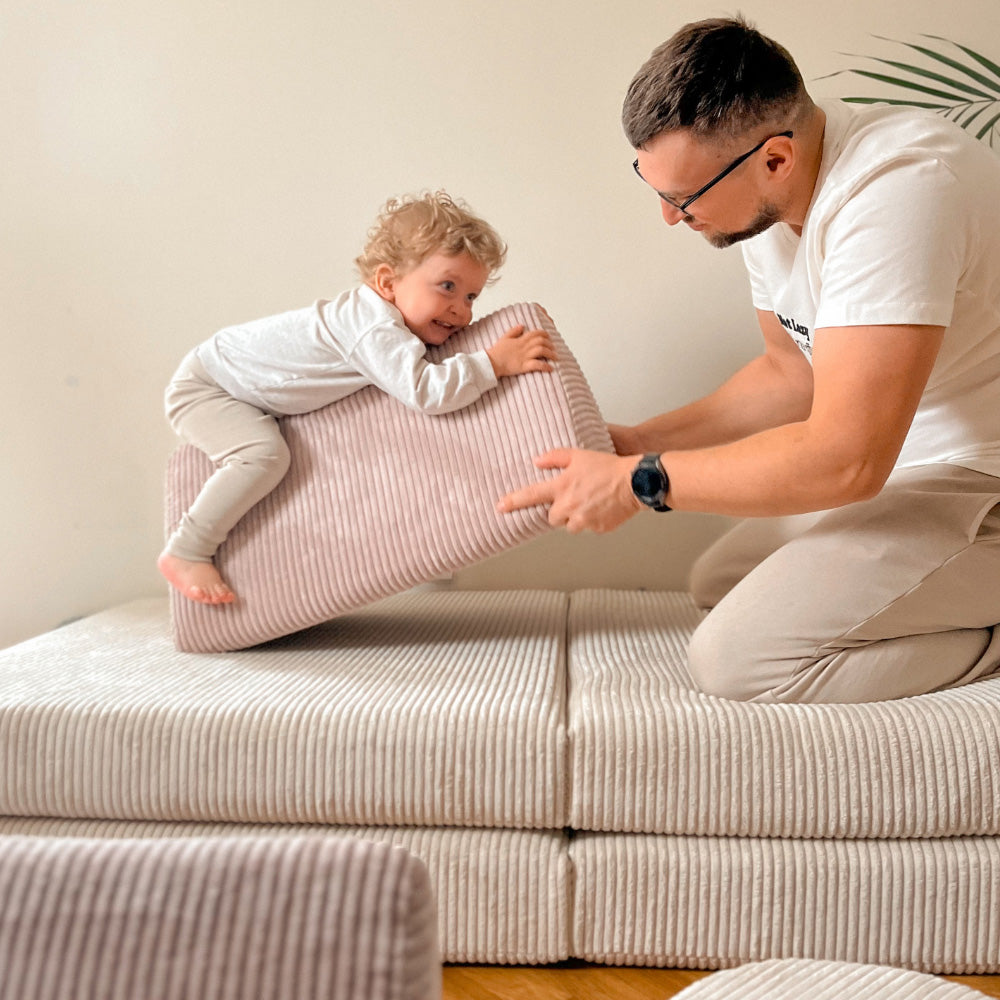 Child playing actively with Shappy modular play sofa instead of using screen devices